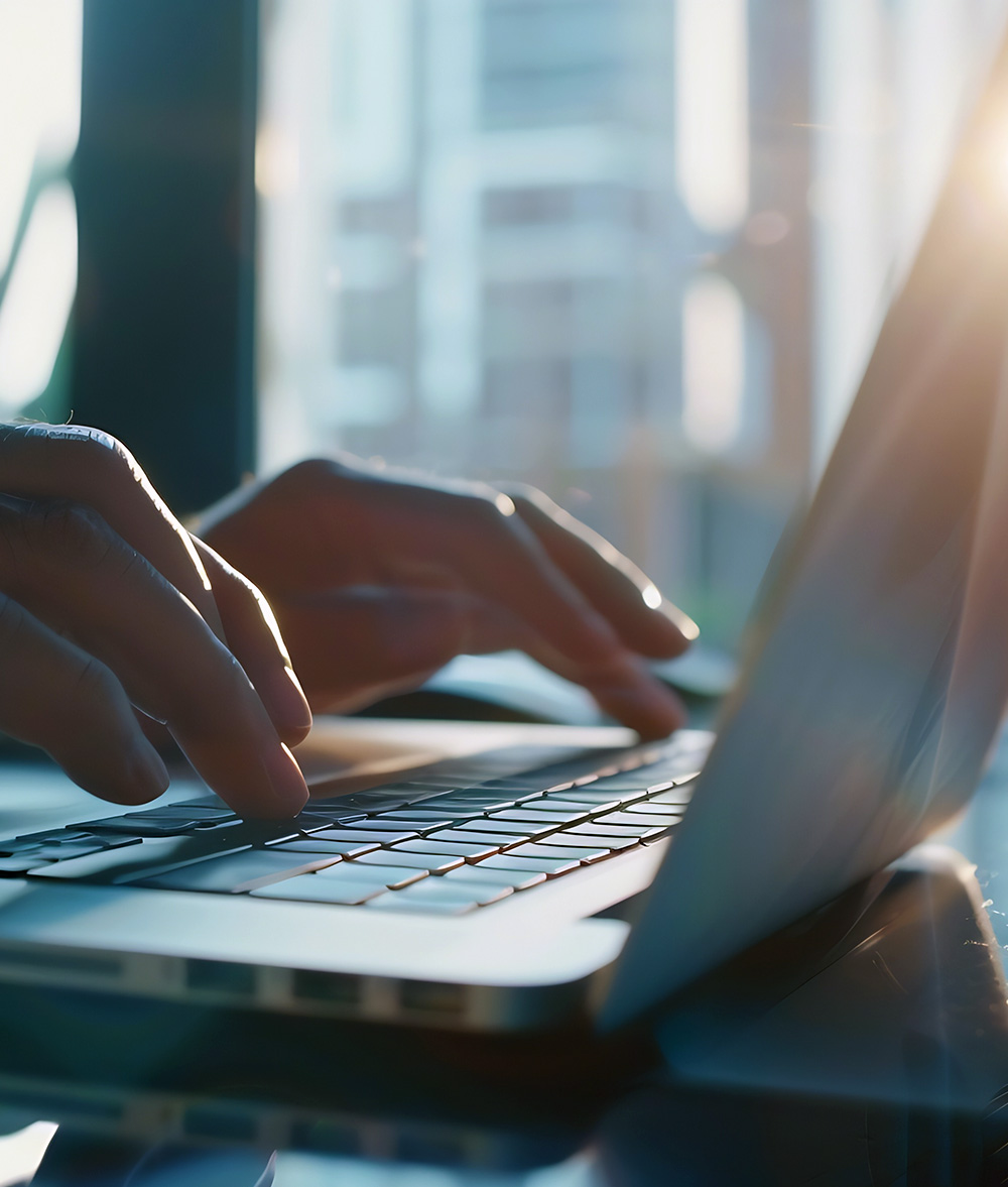 person typing at computer